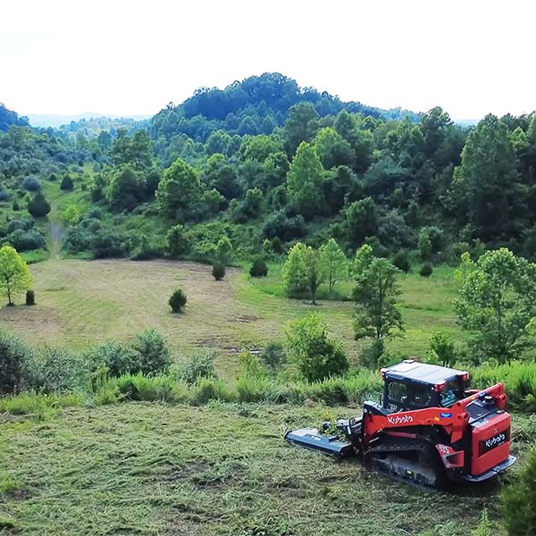 Bush hogging a field and flat hilltop.