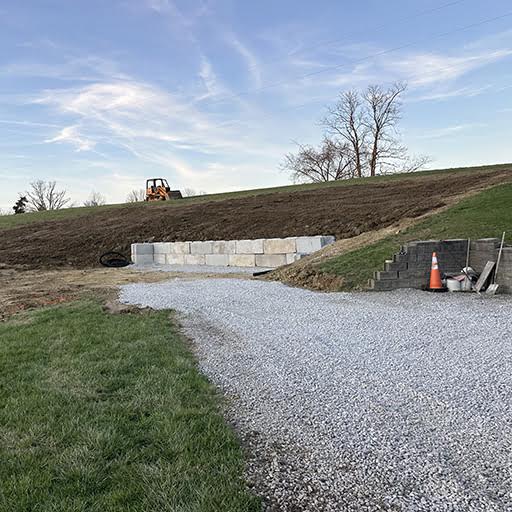 Excavated garage pad and retaining wall